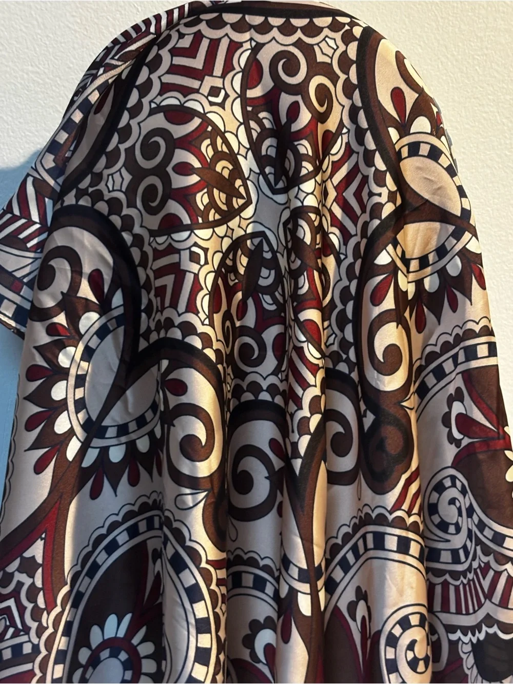 elegant brown, white, and burgundy silk scarf features an ornate floral